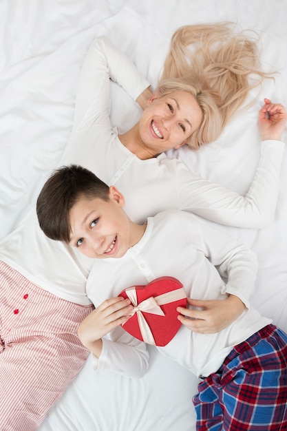 Top view mother and son with chocolate box