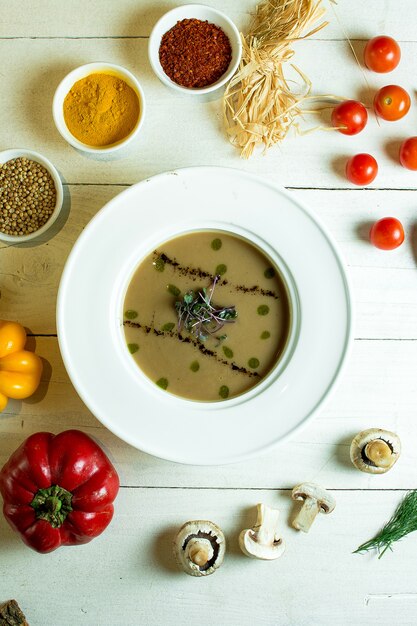 Top view of mushroom cream soup in a white bowl