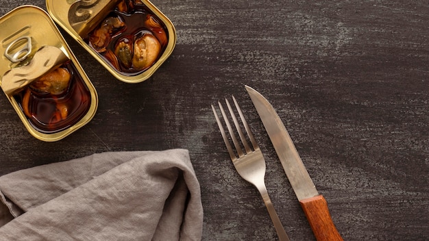 Top view mussels with cutlery and kitchen towel