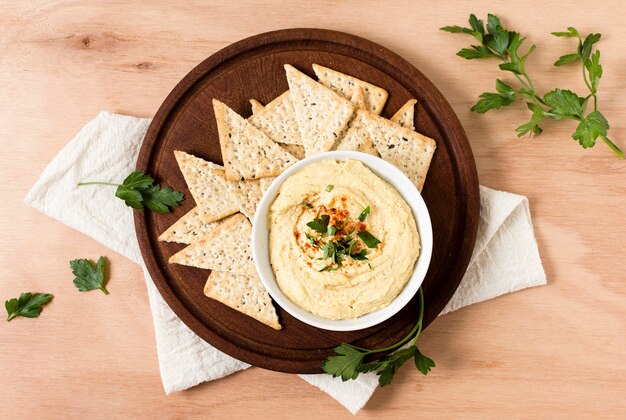 Top view of nacho chips with hummus