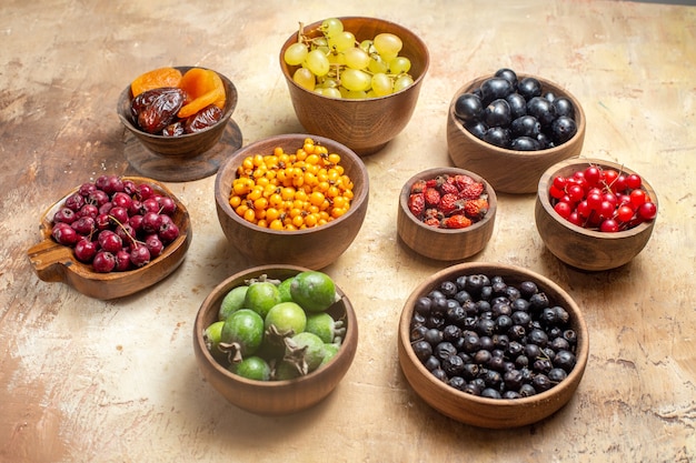 Top view of natural and fresh various fruits in bowls