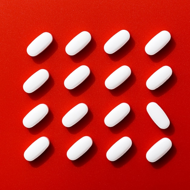 Free Photo top view of neatly arranged pills except one