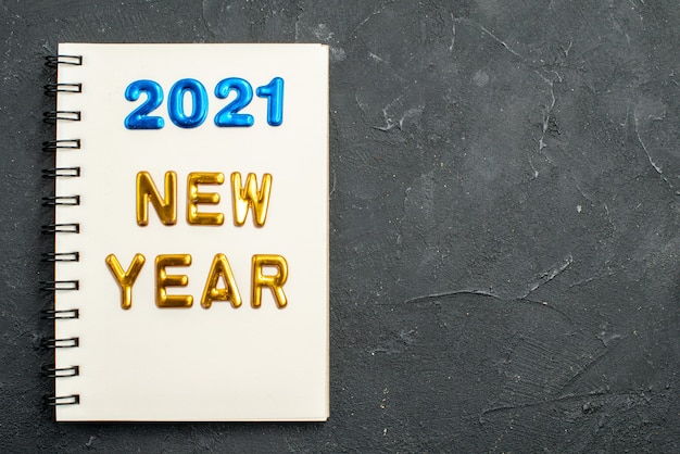 Top view new year note with writing in notepad