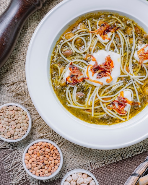 Top view noodle soup with sour cream