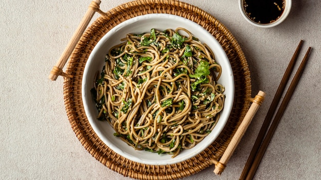 Free photo top view noodles in a bowl composition