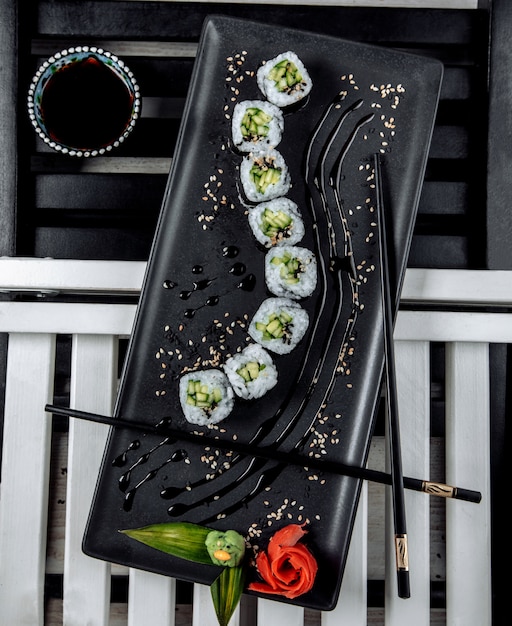 Free photo top view of nori sushi rolls with cucumber