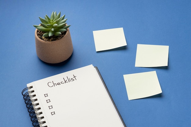 Top view notebook with checklist on desk