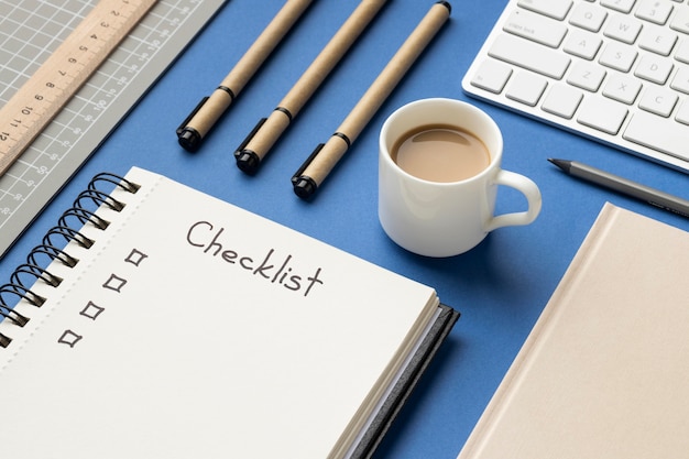 Top view notebook with checklist on desk