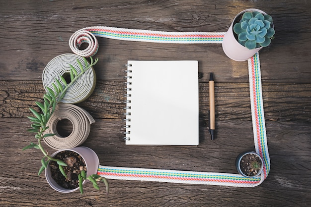 Top view notebook with flowerpots