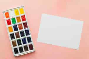 Free photo top view notebook with watercolor