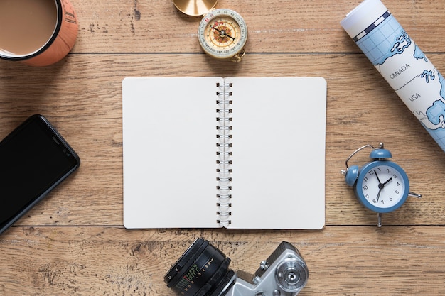 Free photo top view notebook on wooden background