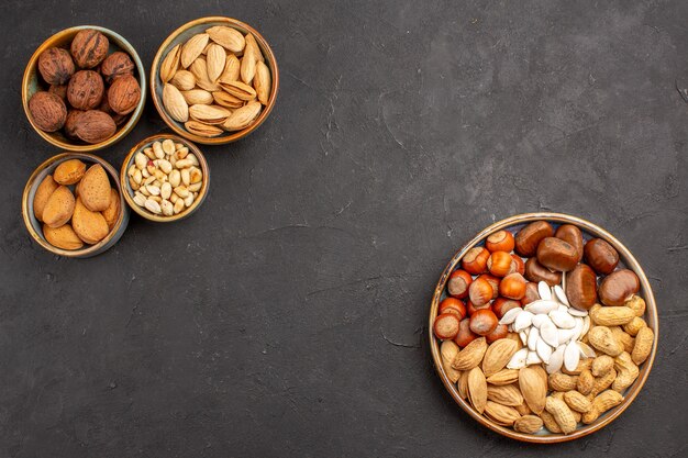 Top view of nut composition walnuts and other nuts on grey surface