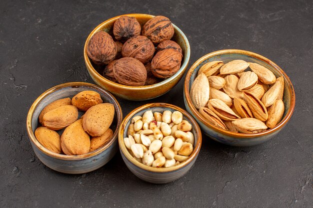 Top view of nut composition walnuts and other nuts on grey surface