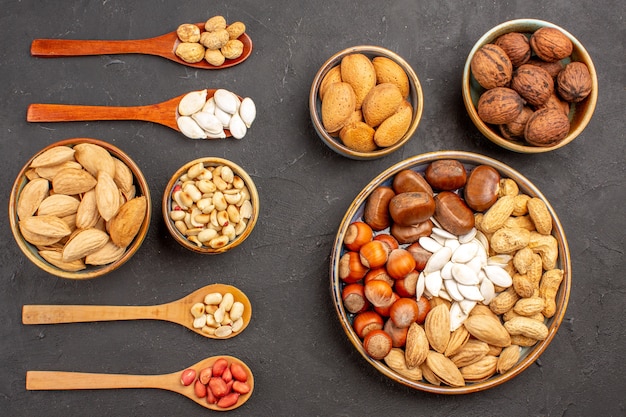 Top view of nut composition with different nuts on a dark surface