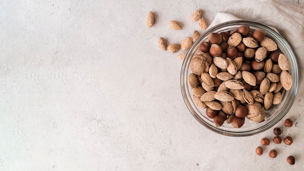 Top view of nuts in bowl with copy space