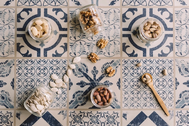 Free Photo top view of nuts on tiles