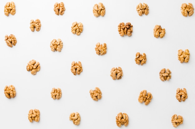 Top view nuts on white table