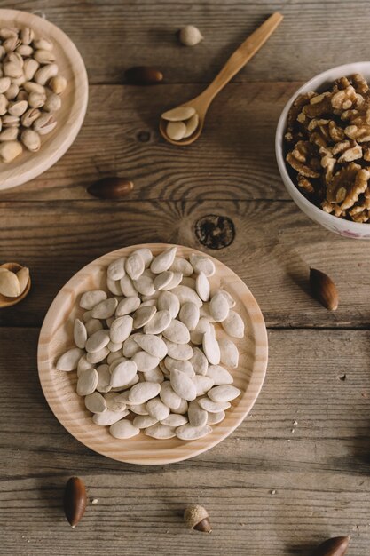 Top view of nuts on wooden plates