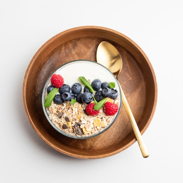 Top view of oatmeal bowl with raspberries and blueberries