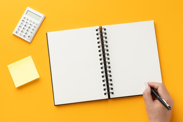 Top view office desk composition with notebook