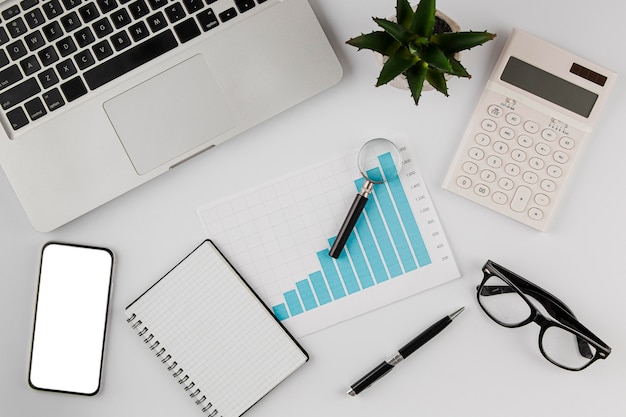 Top view of office desk with growth chart