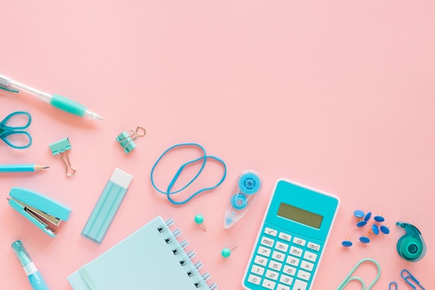 Top view of office stationery with calculator and elastic bands