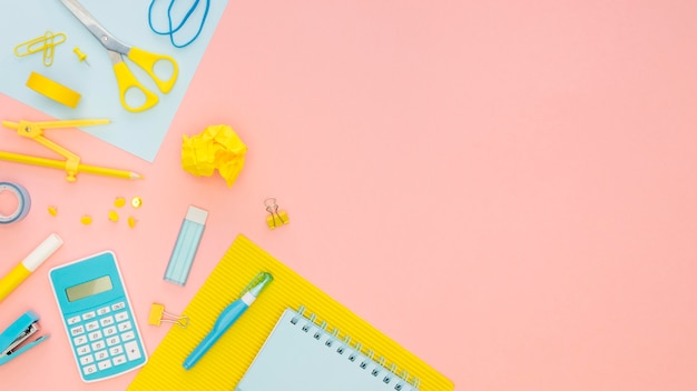 Top view of office stationery with calculator and scissors