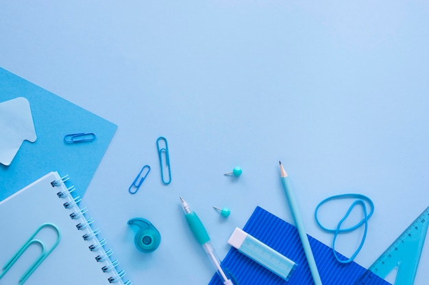 Top view of office stationery with notebook and pencil