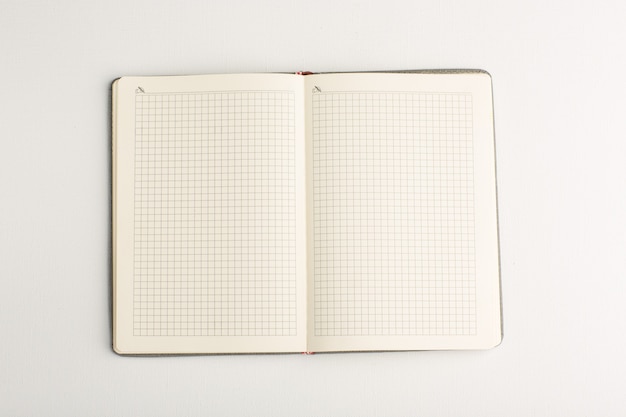 Free photo top view open copybook on white surface