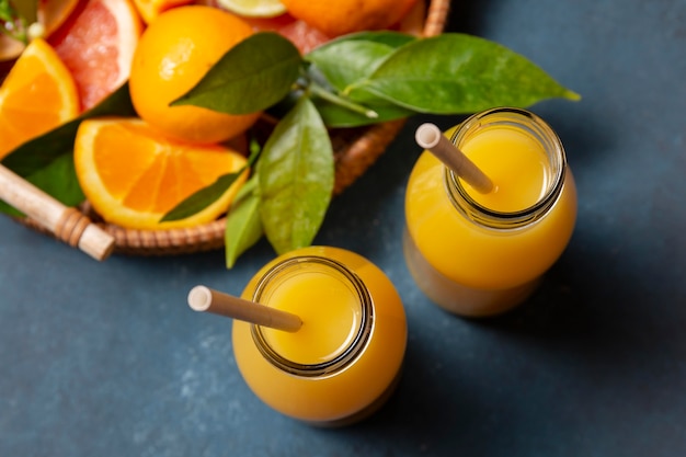 Free Photo top view orange juice with citrus mix