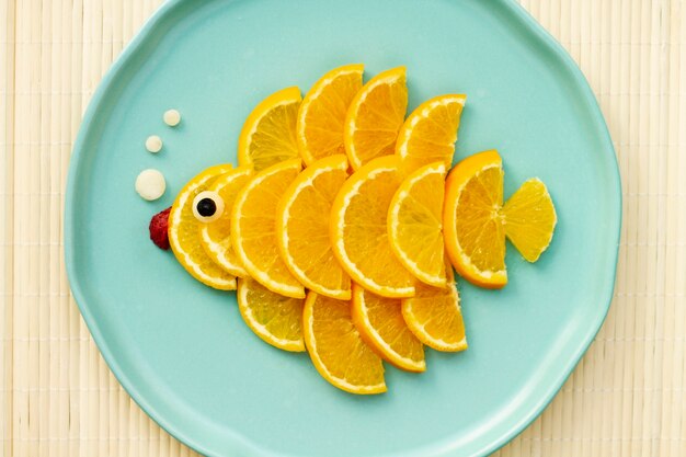 Top view orange slices on plate