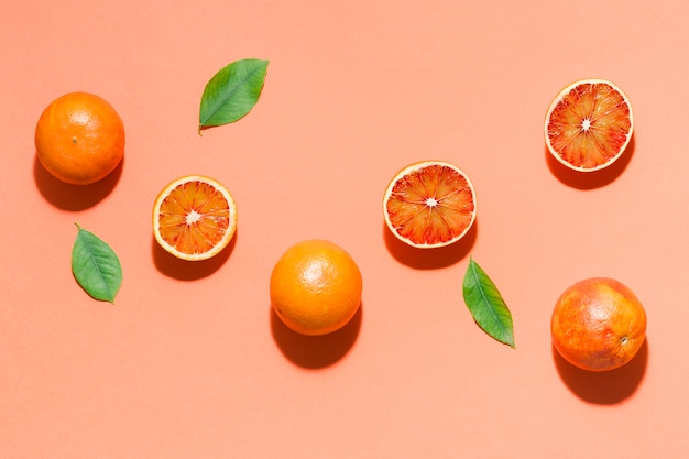 Free Photo top view oranges with leaves