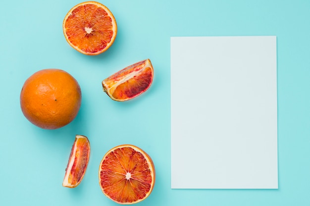 Top view oranges with paper