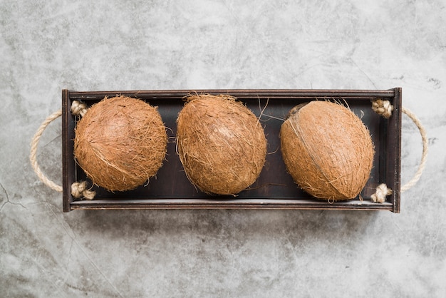 Free Photo top view organic coconuts on the table