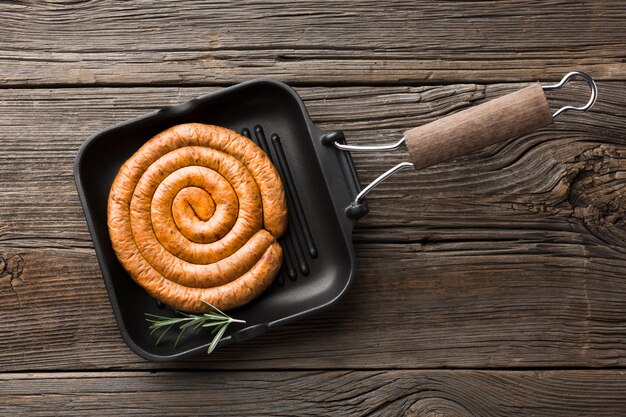 Top view pan with delicious grill sausage