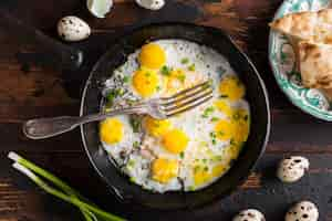 Free photo top view pan with fried eggs