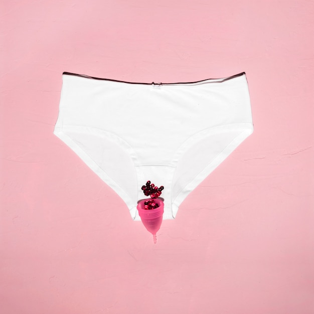 Free photo top view panties with menstrual cup