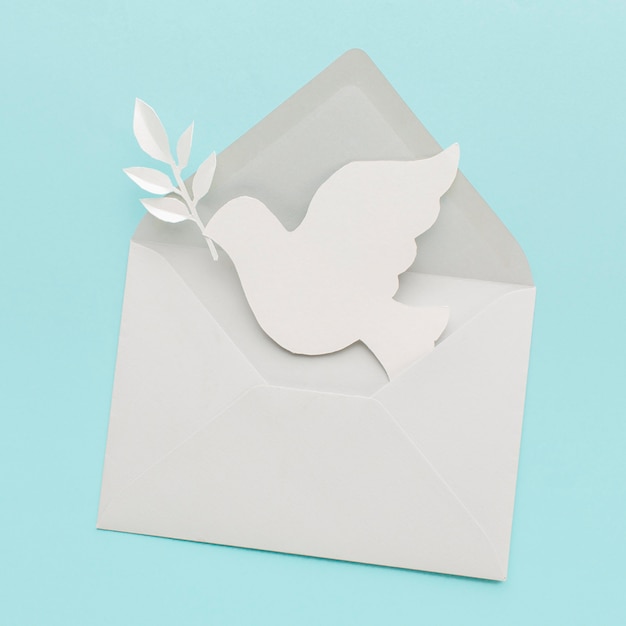 Free photo top view of paper dove in envelope