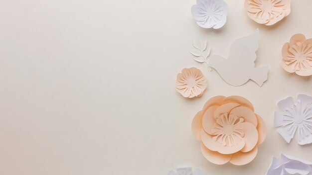 Top view of paper dove with paper flowers