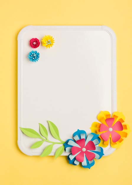 Free Photo top view of paper flowers for spring and whiteboard