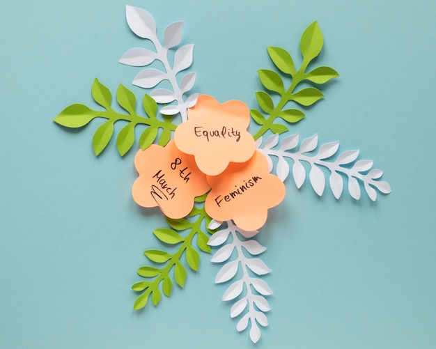 Top view of paper flowers with leaves for women's day