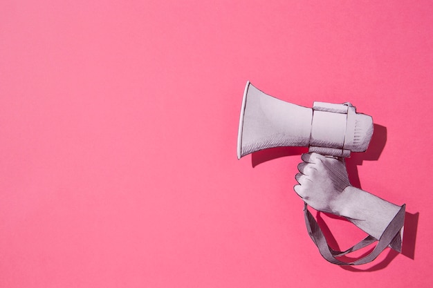 Top view paper megaphone with pink background