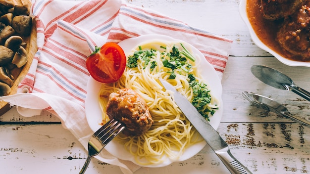 Top view pasta dish with meatball