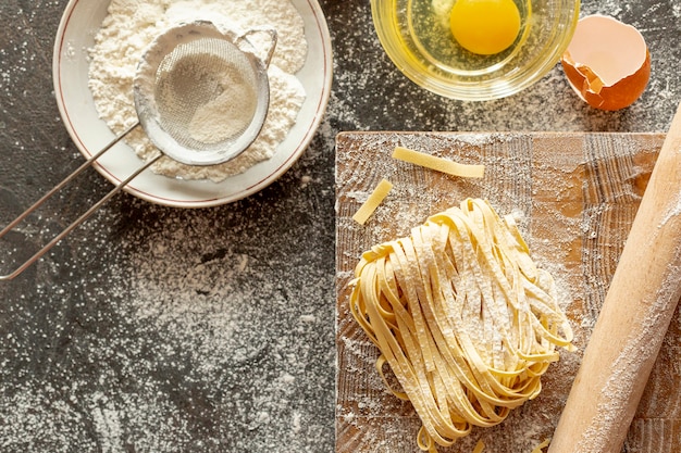 Free photo top view of pasta ingredients and chopper