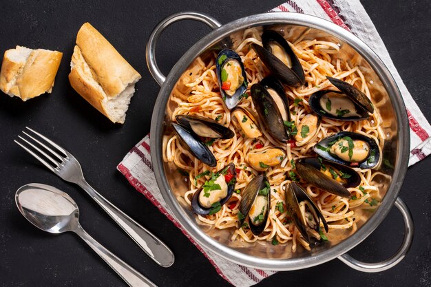 Top view pasta pan with mussels