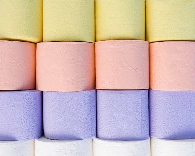 Free photo top view pastel colored toilet paper