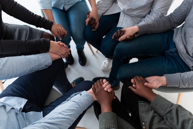 Top view  patients standing in circle and holding hands