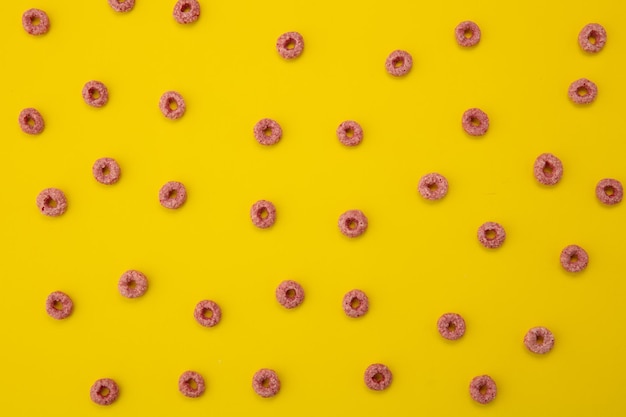 Free photo top view of pattern of cereals on yellow background