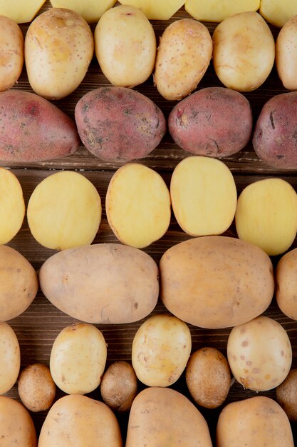 Free photo top view of pattern of whole and sliced potato