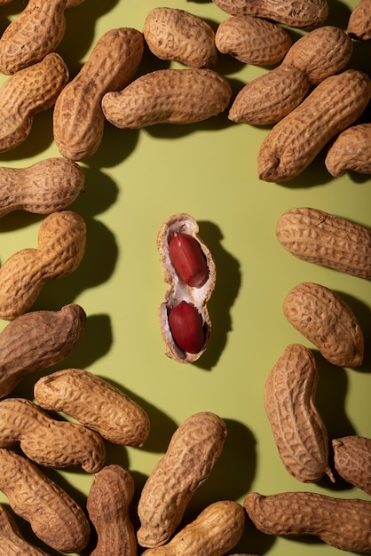 Top view peanuts on green background